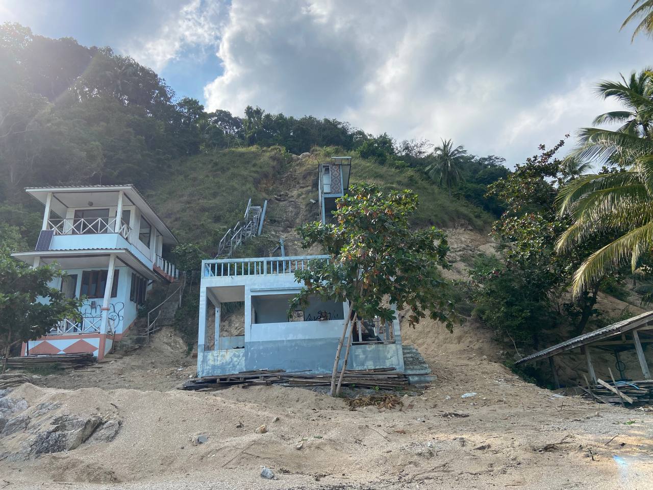 Secluded Haad Nam Tok Beach with serene surroundings and natural beauty on Koh Phangan.