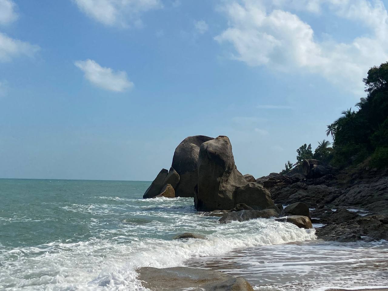 Secluded Haad Nam Tok Beach with serene surroundings and natural beauty on Koh Phangan.