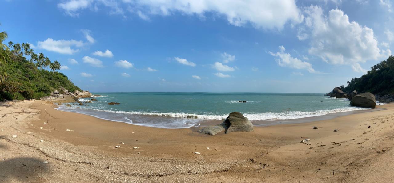 Secluded Haad Nam Tok Beach with serene surroundings and natural beauty on Koh Phangan.