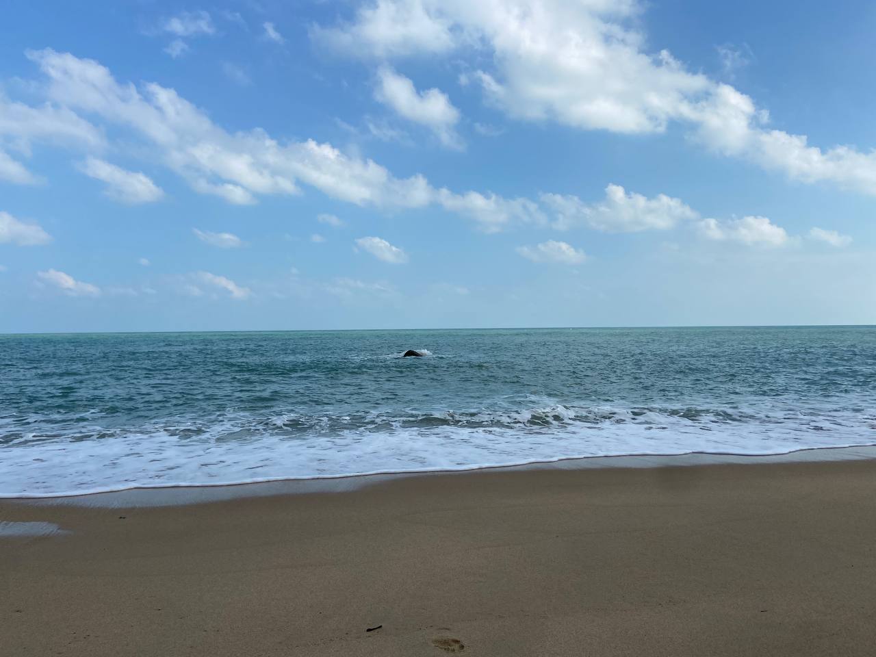 Secluded Haad Nam Tok Beach with serene surroundings and natural beauty on Koh Phangan.