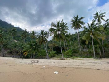 Secluded Haad Nam Tok Beach with serene surroundings and natural beauty on Koh Phangan.
