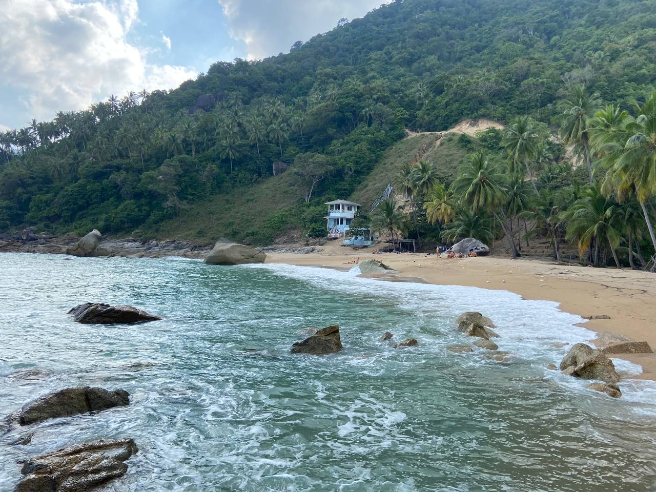 Secluded Haad Nam Tok Beach with serene surroundings and natural beauty on Koh Phangan.