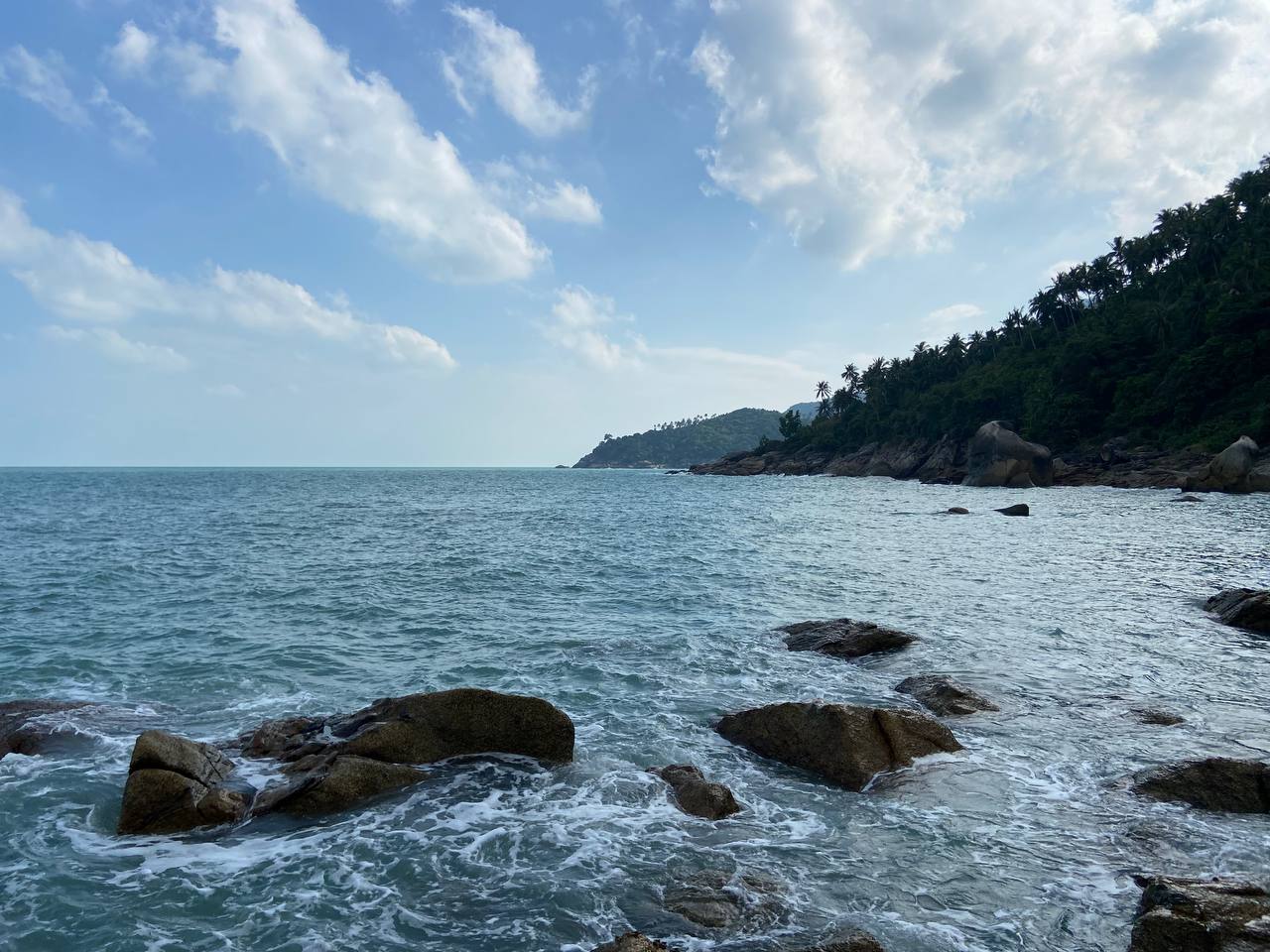 Secluded Haad Nam Tok Beach with serene surroundings and natural beauty on Koh Phangan.