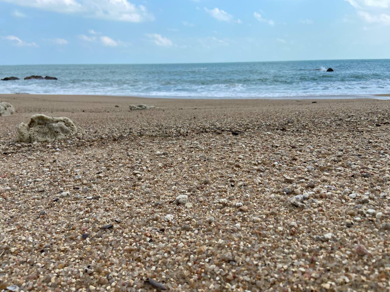 Secluded Haad Nam Tok Beach with serene surroundings and natural beauty on Koh Phangan.