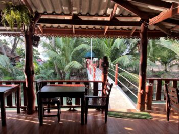 Dining area at Wang Sai Restaurant near the beach, serving Thai food, pizzas, and spaghetti.