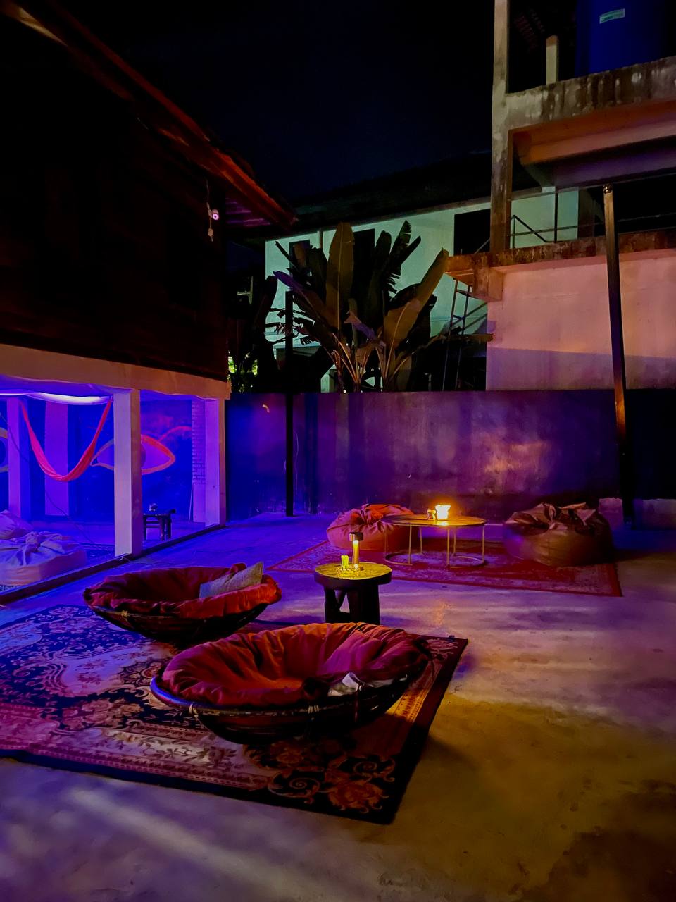 Joka Lounge Bar interior with lounge seating, projector screen, and cozy lighting