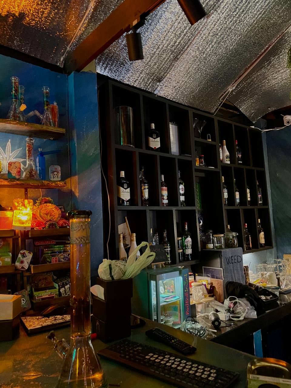 Joka Lounge Bar interior with lounge seating, projector screen, and cozy lighting