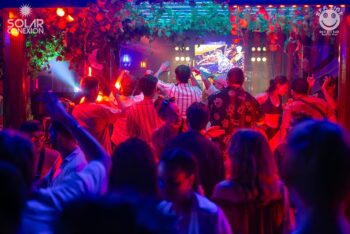 Crowd enjoying a sunset beach party at Seaside Sunset Bar in Haad Rin, Koh Phangan