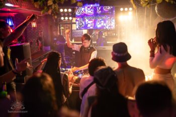 Crowd enjoying a sunset beach party at Seaside Sunset Bar in Haad Rin, Koh Phangan