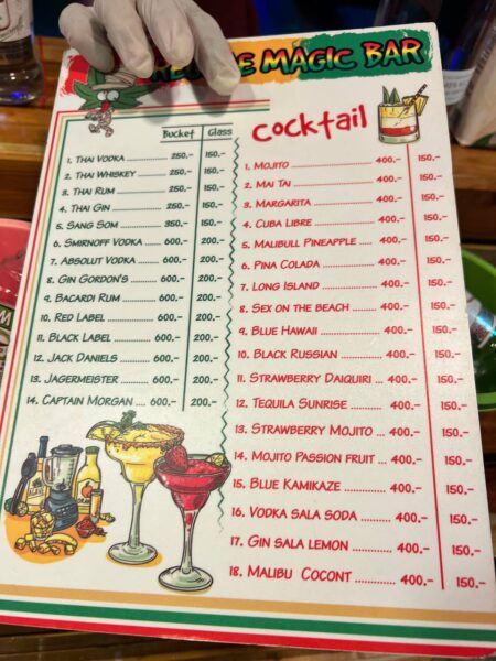 Full Moon Party on Koh Phangan at Haad Rin Beach with neon lights, beach crowd, DJs, and fire show