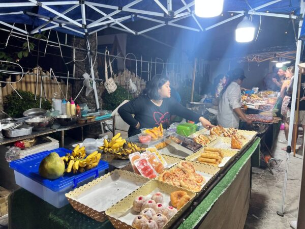 Full Moon Party on Koh Phangan at Haad Rin Beach with neon lights, beach crowd, DJs, and fire show
