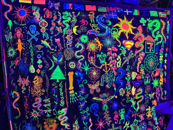 Full Moon Party on Koh Phangan at Haad Rin Beach with neon lights, beach crowd, DJs, and fire show