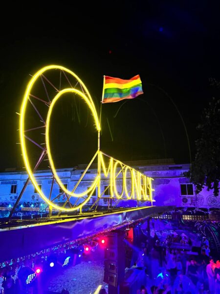 Full Moon Party on Koh Phangan at Haad Rin Beach with neon lights, beach crowd, DJs, and fire show