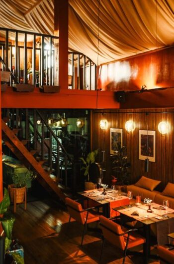 Stylish dining room at Catch Koh Phangan with warm lighting and comfortable seating