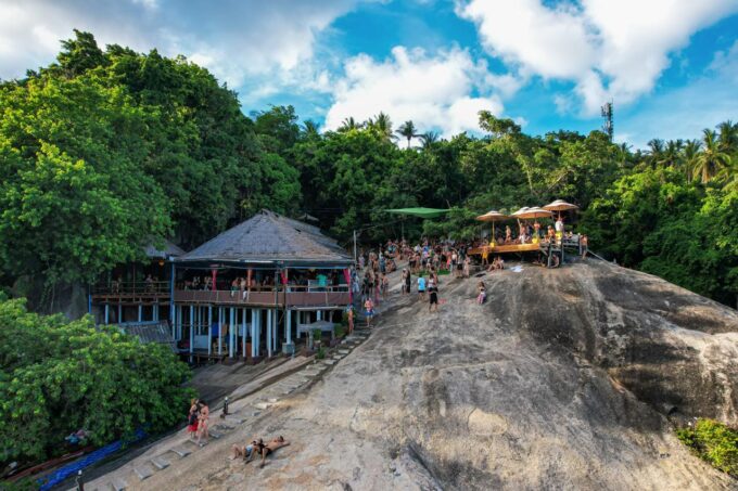 Aerial drone photograph of Koh Phangan showing tropical beaches, lush jungle hills, turquoise waters and island landscapes