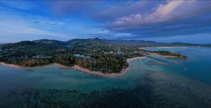 Aerial drone photograph of Koh Phangan showing tropical beaches, lush jungle hills, turquoise waters and island landscapes