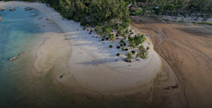 Aerial drone photograph of Koh Phangan showing tropical beaches, lush jungle hills, turquoise waters and island landscapes