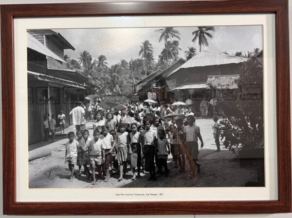 Children and local residents during the Chak Phra Festival procession on Koh Phangan in 1957