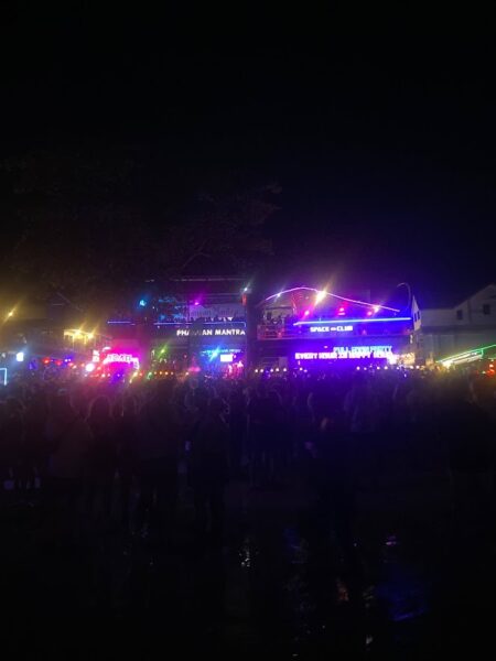 Full Moon Party on Koh Phangan at Haad Rin Beach with neon lights, beach crowd, DJs, and fire show