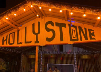 Vibrant nightlife at Hollystone, Koh Phangan with a dance floor, food, cocktails, and DJs in a jungle setting.